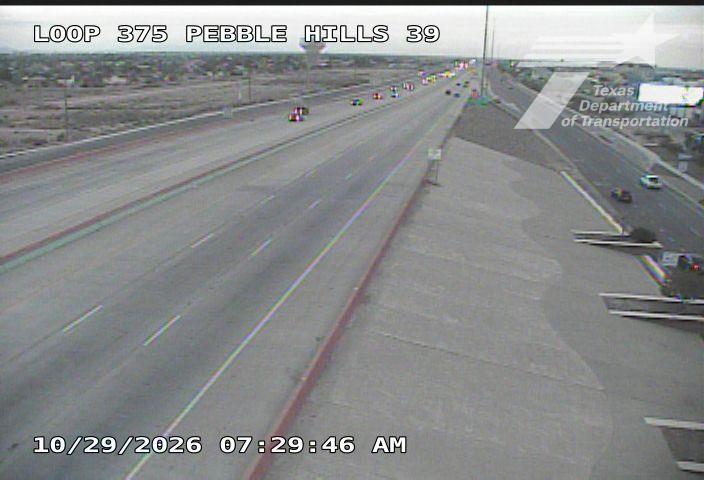 Light traffic flows along a multi-lane highway with no visible incidents or road work; weather appears clear and visibility is good.