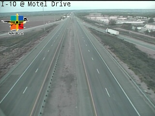 Empty highway with no visible traffic or incidents, under overcast skies.